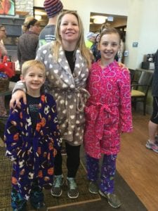 A family showing off their pajamas at the PJ 5K/10K.